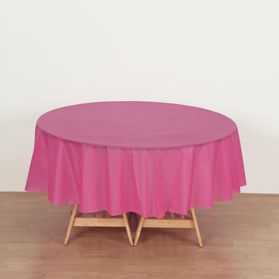 round fuchsia plastic table cover