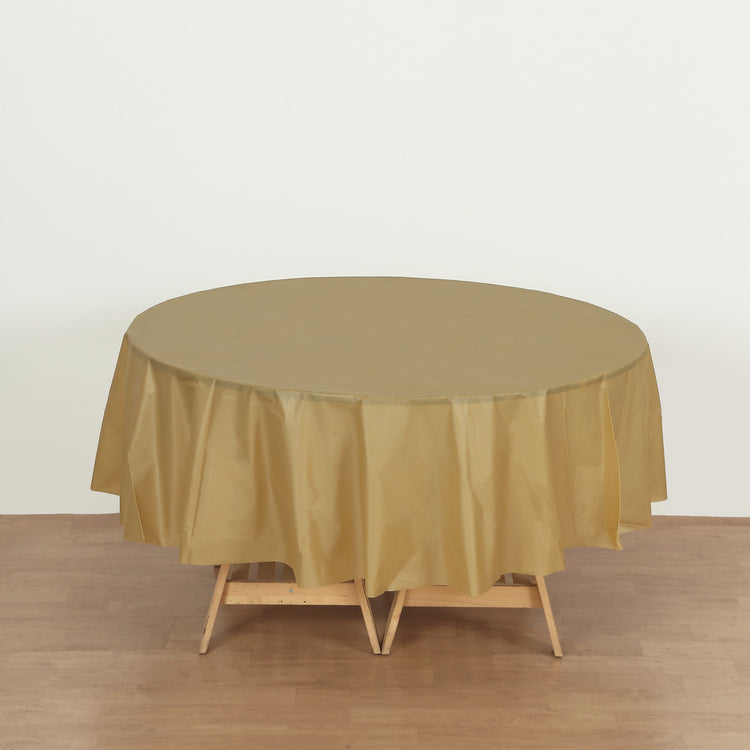 round gold plastic table cover